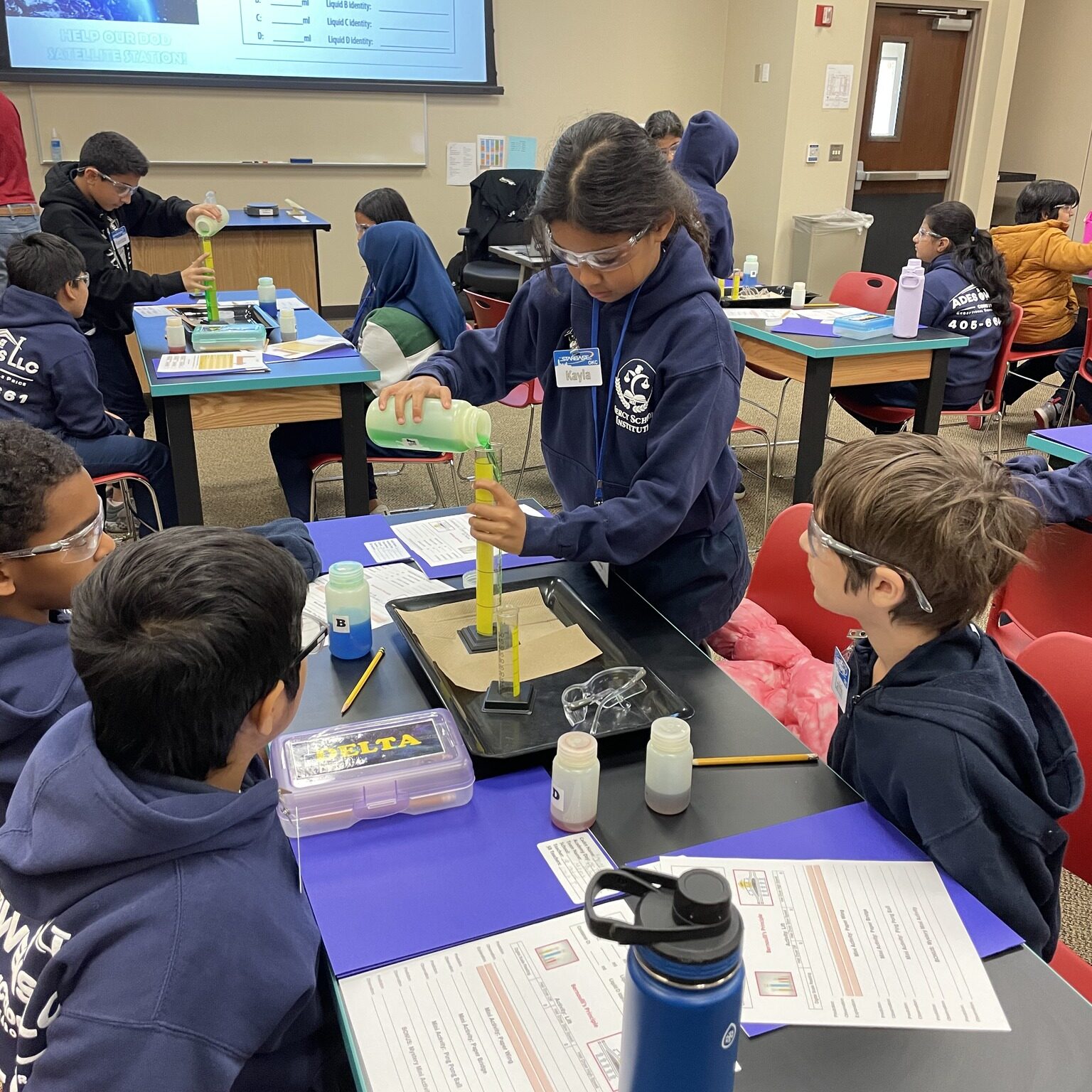 Student using a graduated cylinder.