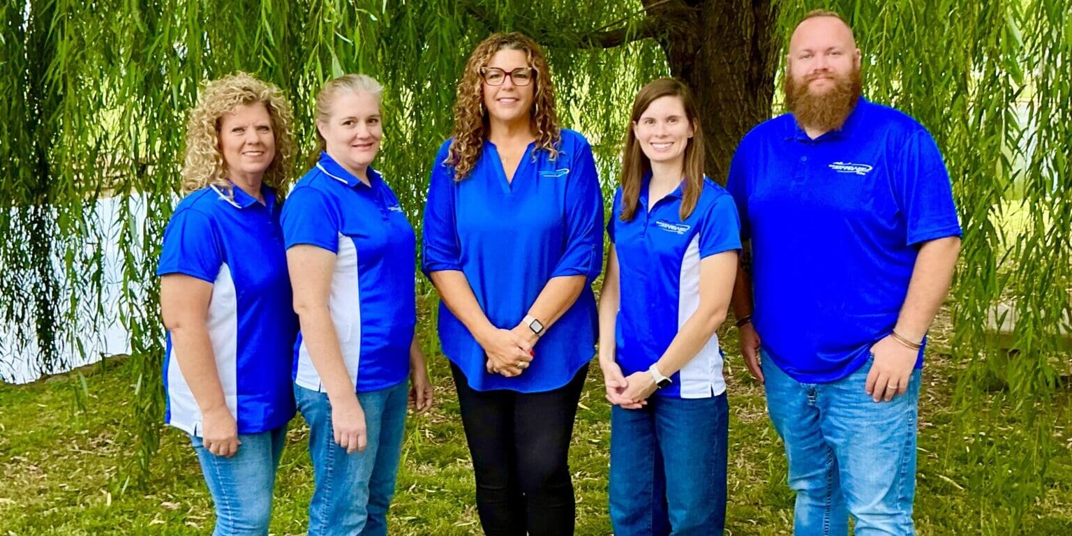 Group photo of Starbase Tulsa staff standing outdoors in front of trees.